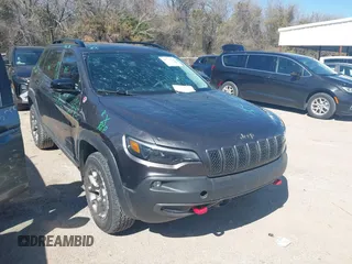 2022 Jeep Cherokee Trailhawk with VIN 1C4PJMBX4ND535037, listed as a IAAI auction lot 41779140 with 49,733 mi miles. Bid and sale history available at carsss.com. Image 1.