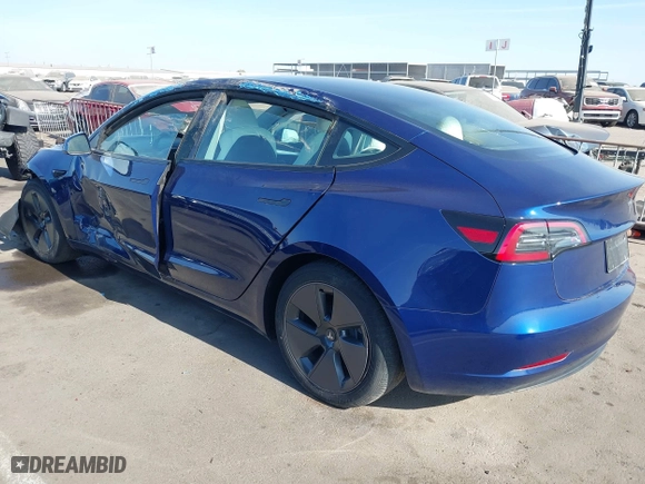 2023 Tesla Model 3 with VIN 5YJ3E1EA9PF697573, listed as a IAAI auction lot 41173833 with 6,966 mi miles. Bid and sale history available at carsss.com. Image 3.