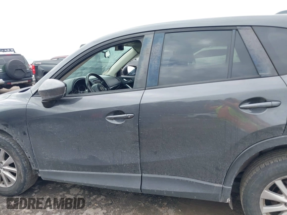 2015 Mazda CX-5 Touring with VIN JM3KE2CY2F0461935, listed as a IAAI auction lot 41430070 with 220,857 mi miles and . Bid and sale history available at DreamBid. Image 14.