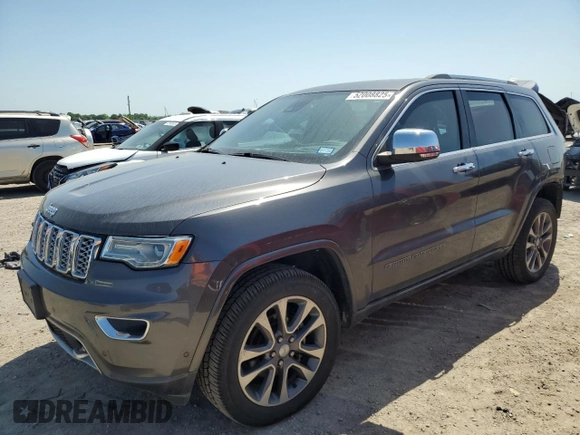 2017 Jeep Grand Cherokee Overland with VIN 1C4RJFCGXHC941983, listed as a Copart auction lot 52008825 with 65,776 mi miles and Salvage Title. Bid and sale history available at carsss.com. Image 1.