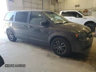 2015 Dodge Grand Caravan SE with VIN 2C4RDGBG6FR668740, listed as a Copart auction lot 50211885 with 129,695 mi miles and Salvage Title. Bid and sale history available at DreamBid. Image 4.