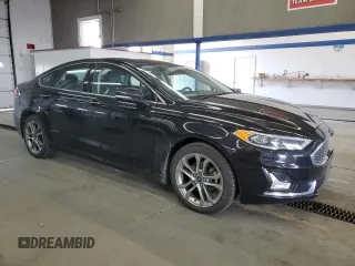 2020 Ford Fusion Titanium with VIN 3FA6P0RUXLR182408, listed as a Copart auction lot 56897105 with 100,021 mi miles and Salvage title. Bid and sale history available at DreamBid. Image 4.
