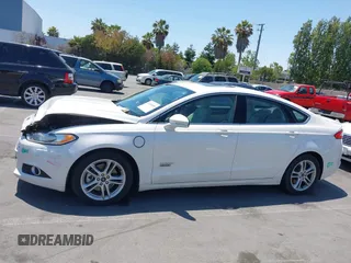 2016 Ford Fusion Titanium z VIN 3FA6P0SU1GR116118, wystawiony jako IAAI lot #42685489 z przebiegiem 138 690 mil mil oraz . Historia ofert i sprzedaży dostępna na DreamBid. Obrazek 14.