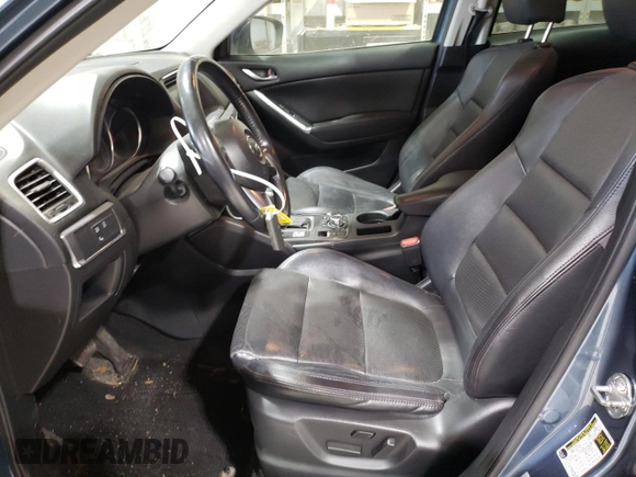 2016 Mazda CX-5 Grand Touring with VIN JM3KE4DY1G0714674, listed as a Copart auction lot 75516524 with 115,766 mi miles and Salvage Title. Bid and sale history available at carsss.com. Image 7.