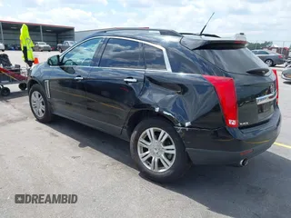 2014 Cadillac SRX with VIN 3GYFNAE30ES641616, listed as a IAAI auction lot 42000120 with 145,000 mi miles and . Bid and sale history available at DreamBid. Image 3.