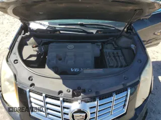 2015 Cadillac SRX Performance Collection z VIN 3GYFNCE37FS576972, wystawiony jako Copart lot #55226495 z przebiegiem 167 977 mil mil oraz Szkoda całkowita • Salvage title. Historia ofert i sprzedaży dostępna na DreamBid. Obrazek 11.
