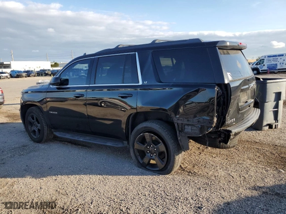 2019 Chevrolet Tahoe LT with VIN 1GNSCBKC0KR266577, listed as a Copart auction lot 79674694 with 75,002 mi miles and Salvage Title. Bid and sale history available at carsss.com. Image 2.