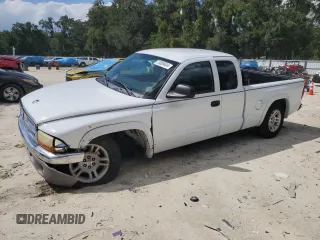 2003 Dodge Dakota SLT with VIN 1D7HL42XX3S333865, listed as a Copart auction lot 73509404 with 123,515 mi miles and Salvage Title. Bid and sale history available at carsss.com. Image 1.