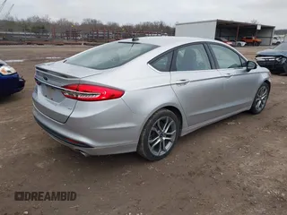 2017 Ford Fusion SE z VIN 3FA6P0H78HR174956, wystawiony jako IAAI lot #41258610 z przebiegiem 70 180 mil mil oraz . Historia ofert i sprzedaży dostępna na DreamBid. Obrazek 4.