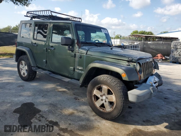 2008 Jeep Wrangler Unlimited Sahara with VIN 1J4GA59198L566019, listed as a Copart auction lot 53975965 with 184,612 mi miles and Salvage Title. Bid and sale history available at carsss.com. Image 4.