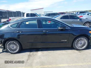 2013 Ford Fusion Titanium Hybrid with VIN 3FA6P0RU2DR288773, listed as a IAAI auction lot 41803708 with 85,868 mi miles and . Bid and sale history available at DreamBid. Image 13.
