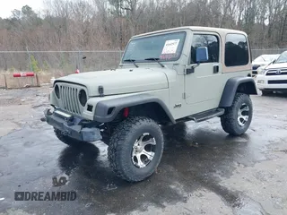 1999 Jeep Wrangler Sahara with VIN 1J4FY49S0XP480017, listed as a IAAI auction lot 41642577 with 154,068 mi miles. Bid and sale history available at carsss.com. Image 17.