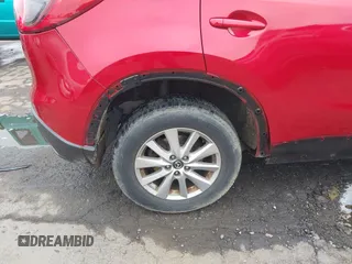 2015 Mazda CX-5 Sport z VIN JM3KE2BE9F0452625, wystawiony jako IAAI lot #42114867 z przebiegiem 167 849 mil mil oraz . Historia ofert i sprzedaży dostępna na DreamBid. Obrazek 16.