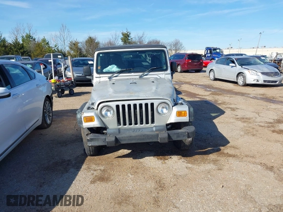 2004 Jeep Wrangler Sport Right Hand Drive with VIN 1J4F449SX4P780560, listed as a IAAI auction lot 41645721 with 146,681 mi miles. Bid and sale history available at carsss.com. Image 12.