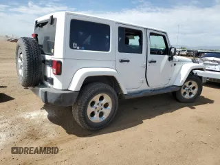 2014 Jeep Wrangler Unlimited Sahara with VIN 1C4BJWEG1EL210949, listed as a Copart auction lot 60977555 with 122,495 mi miles and Salvage title. Bid and sale history available at DreamBid. Image 3.