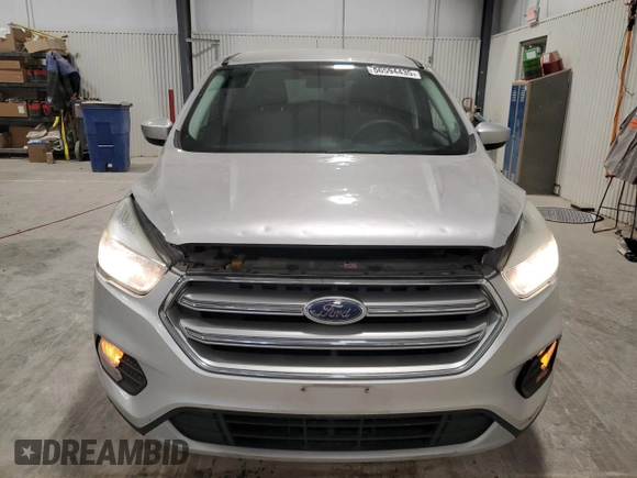 2017 Ford Escape SE z VIN 1FMCU9G90HUA69507, wystawiony jako Copart lot #56594435 z przebiegiem 102 261 mil mil oraz Szkoda całkowita • Salvage title. Historia ofert i sprzedaży dostępna na DreamBid. Obrazek 5.