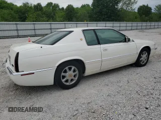 2000 Cadillac Eldorado Touring with VIN 1G6ET1298YB702875, listed as a Copart auction lot 54434255 with 135,282 mi miles and Salvage Title. Bid and sale history available at DreamBid. Image 3.