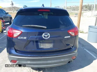 2014 Mazda CX-5 Grand Touring with VIN JM3KE2DY7E0376389, listed as a IAAI auction lot 42014946 with 126,081 mi miles. Bid and sale history available at carsss.com. Image 16.