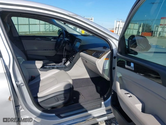 2016 Hyundai Sonata Hybrid Limited with VIN KMHE34L10GA018216, listed as a IAAI auction lot 41281991 with 129,429 mi miles. Bid and sale history available at carsss.com. Image 5.