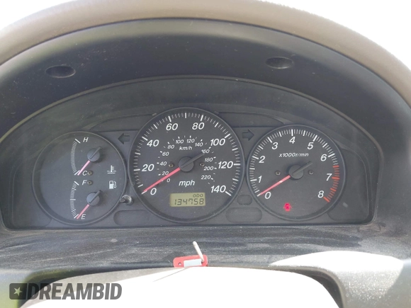 2002 Mazda Protege DX z VIN JM1BJ225021606891, wystawiony jako IAAI lot #42011997 z przebiegiem 134 758 mil mil oraz . Historia ofert i sprzedaży dostępna na DreamBid. Obrazek 7.