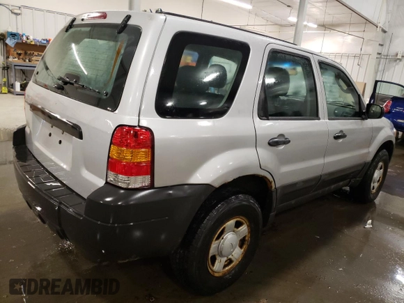 2007 Ford Escape XLS with VIN 1FMCU92Z77KA84801, listed as a Copart auction lot 82052144 with 180,774 mi miles and Salvage title. Bid and sale history available at DreamBid. Image 3.