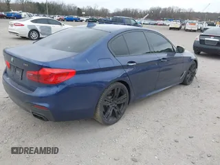 2018 BMW 5 Series M550i xDrive with VIN WBAJB9C56JG463891, listed as a IAAI auction lot 41731556 with 104,860 mi miles. Bid and sale history available at carsss.com. Image 4.