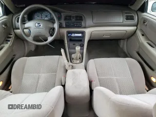 2001 Mazda 626 LX z VIN 1YVGF22C515251837, wystawiony jako Copart lot #56854605 z przebiegiem 173 148 mil mil oraz Szkody całkowita. Historia ofert i sprzedaży dostępna na DreamBid. Obrazek 8.