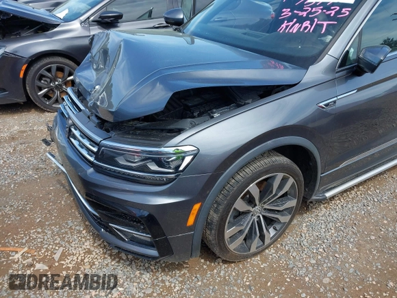 2018 Volkswagen Tiguan SEL Premium with VIN 3VV5B7AX4JM201579, listed as a IAAI auction lot 41932201 with 118,728 mi miles and . Bid and sale history available at DreamBid. Image 6.