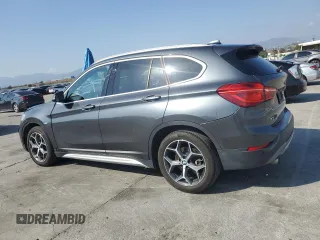 2018 BMW X1 sDrive28i with VIN WBXHU7C35J5L09783, listed as a Copart auction lot 55147935 with 37,114 mi miles and Salvage Title. Bid and sale history available at DreamBid. Image 2.