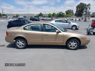 1999 Oldsmobile Alero GL z VIN 1G3NL52T1XC384073, wystawiony jako IAAI lot #42359330 z przebiegiem 177 869 mil mil oraz . Historia ofert i sprzedaży dostępna na DreamBid. Obrazek 13.