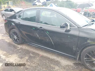 2023 Toyota Camry SE with VIN 4T1G11AKXPU827360, listed as a IAAI auction lot 42217356 with 57,497 mi miles and . Bid and sale history available at DreamBid. Image 6.