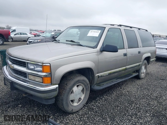 1999 Chevrolet Suburban z VIN 3GNFK16RXXG156463, wystawiony jako IAAI lot #41745169 z przebiegiem 165 541 mil mil oraz . Historia ofert i sprzedaży dostępna na DreamBid. Obrazek 2.