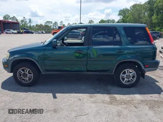 2000 Honda CR-V SE z VIN JHLRD1870YS009867, wystawiony jako IAAI lot #42399220 z przebiegiem 254 367 mil mil oraz . Historia ofert i sprzedaży dostępna na DreamBid. Obrazek 14.