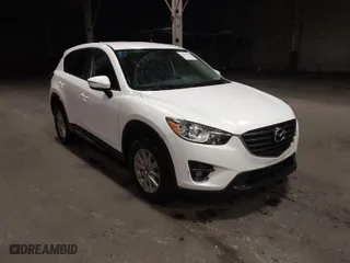 2016 Mazda CX-5 Touring with VIN JM3KE4CY0G0853261, listed as a IAAI auction lot 41861176 with 63,491 mi miles. Bid and sale history available at carsss.com. Image 1.