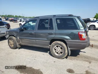 2002 Jeep Grand Cherokee Laredo with VIN 1J4GW48S02C174656, listed as a Copart auction lot 56954155 with 235,427 mi miles and Salvage title. Bid and sale history available at DreamBid. Image 2.