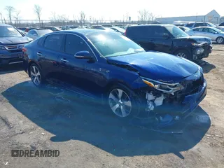 2019 Kia Optima LX with VIN 5XXGT4L35KG303814, listed as a IAAI auction lot 41769183 with 107,509 mi miles. Bid and sale history available at carsss.com. Image 1.