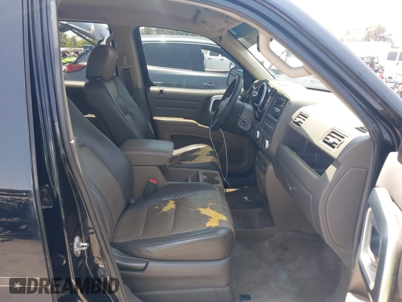2006 Honda Ridgeline RTL with VIN 2HJYK16576H566002, listed as a IAAI auction lot 42595698 with 212,637 mi miles and . Bid and sale history available at DreamBid. Image 5.