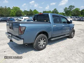 2011 Nissan Titan SL with VIN 1N6AA0EC4BN305296, listed as a Copart auction lot 59001395 with 194,557 mi miles and Salvage title. Bid and sale history available at DreamBid. Image 3.