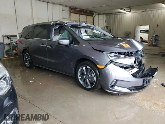 2023 Honda Odyssey Elite with VIN 5FNRL6H98PB056770, listed as a Copart auction lot 56984055 with Not provided miles and Salvage title. Bid and sale history available at DreamBid. Image 4.