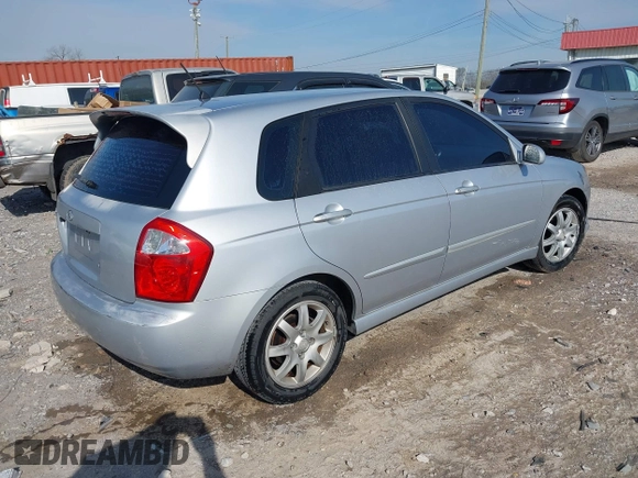 2006 Kia Spectra with VIN KNAFE161365208111, listed as a IAAI auction lot 41886193 with 292,535 mi miles. Bid and sale history available at carsss.com. Image 4.