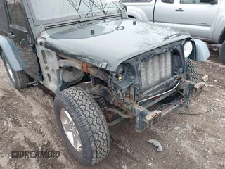 2011 Jeep Wrangler Sport with VIN 1J4AA2D18BL588273, listed as a IAAI auction lot 41857858 with 136,473 mi miles and . Bid and sale history available at carsss.com. Image 6.