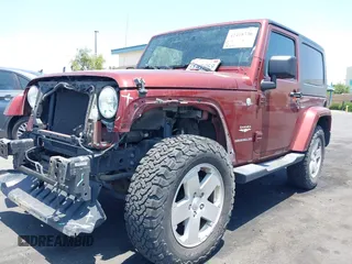 2010 Jeep Wrangler Sahara z VIN 1J4AA5D14AL125062, wystawiony jako IAAI lot #42418736 z przebiegiem 90 839 mil mil oraz . Historia ofert i sprzedaży dostępna na DreamBid. Obrazek 2.