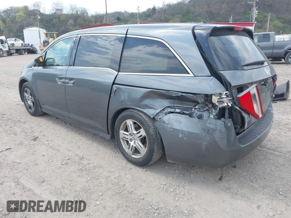 2012 Honda Odyssey Touring with VIN 5FNRL5H90CB045430, listed as a IAAI auction lot 42079770 with 113,901 mi miles and . Bid and sale history available at DreamBid. Image 3.