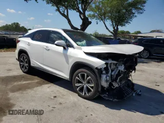 2020 Lexus RX with VIN 2T2HGMDA2LC050011, listed as a Copart auction lot 50695395 with 75,567 mi miles and Salvage Title. Bid and sale history available at carsss.com. Image 4.