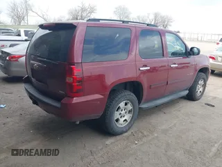 2007 Chevrolet Tahoe LTZ with VIN 1GNFK130X7J313106, listed as a IAAI auction lot 42042891 with 199,763 mi miles and . Bid and sale history available at DreamBid. Image 4.
