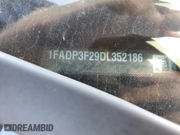 2013 Ford Focus SE with VIN 1FADP3F29DL352186, listed as a Copart auction lot 64972835 with 74,409 mi miles and Clean title. Bid and sale history available at DreamBid. Image 12.