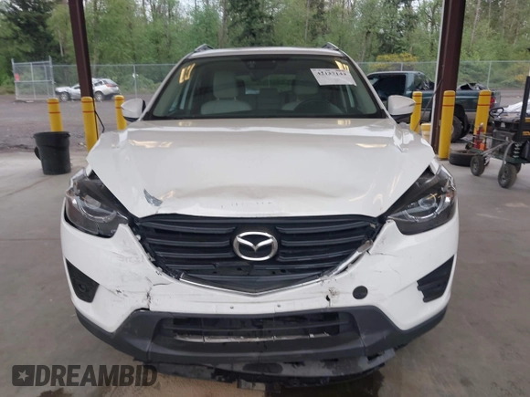 2016 Mazda CX-5 Grand Touring with VIN JM3KE2DYXG0675619, listed as a IAAI auction lot 42137144 with 106,262 mi miles and . Bid and sale history available at DreamBid. Image 12.