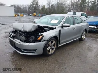 2012 Volkswagen Passat SE w/Sunroof with VIN 1VWBP7A35CC081714, listed as a IAAI auction lot 41864409 with 152,603 mi miles. Bid and sale history available at carsss.com. Image 2.