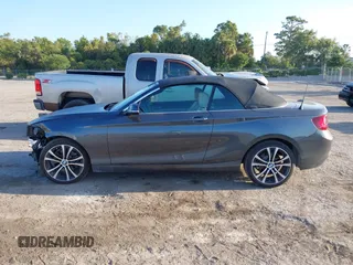 2020 BMW 2 Series 230i xDrive with VIN WBA2K1C08L7G28887, listed as a IAAI auction lot 42122785 with 30,599 mi miles and . Bid and sale history available at carsss.com. Image 14.