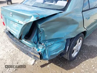 2002 Mazda Protege DX z VIN JM1BJ225721591435, wystawiony jako IAAI lot #42117544 z przebiegiem 191 185 mil mil oraz . Historia ofert i sprzedaży dostępna na DreamBid. Obrazek 6.